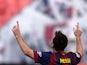 Barcelona's Argentinian forward Lionel Messi celebrates after scoring during the Spanish league football match Rayo Vallecano de Madrid vs Barcelona at the Vallecas stadium in Madrid on October 4, 2014