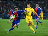 Taulant Xhaka of FC Basel and Lazar Markovic of Liverpool battle for the ball during the UEFA Champions League Group B match between FC Basel 1893 and Liverpool FC at St. Jakob Stadium on October 1, 2014