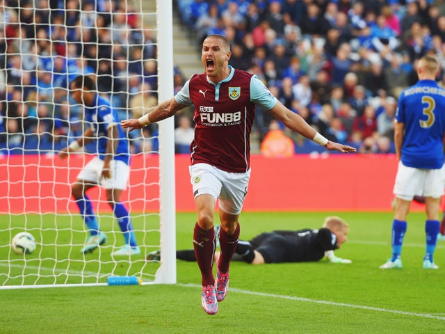 Michael Kightly of Burnley celebrates as he scores their first goal during the Barclays Premier League match between Leicester City and Burnley at The King Power Stadium on October 4, 2014