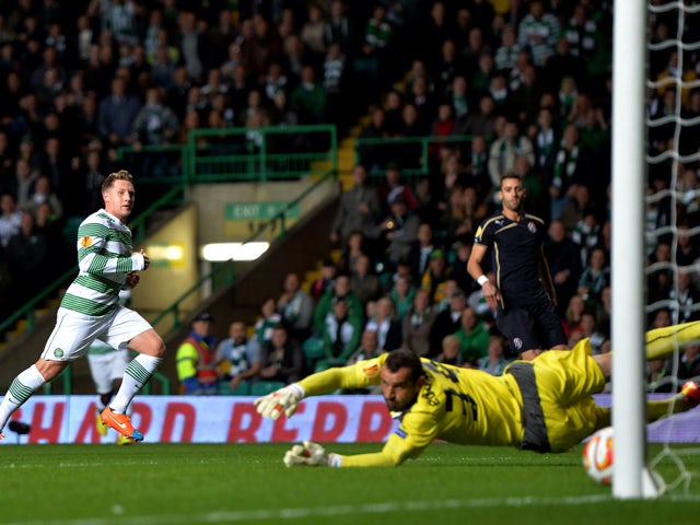 Kris Commons of Celtic scores the first goal during the UEFA Europa League group D match between Celtic and Dinamo Zagreb at Celtic Park on October 02, 2014
