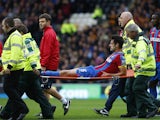 Crystal Palace's English defender Scott Dann is taken off injured on a stretcher during the English Premier League football match between Hull City and Crystal Palace at the KC Stadium in Kingston upon Hull on October 4, 2014