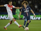 Paris Saint-Germain's Brazilian defender David Luiz (R) challenges Monaco's Argentine midfielder Lucas Ocampos during the French L1 football match on October 5, 2014