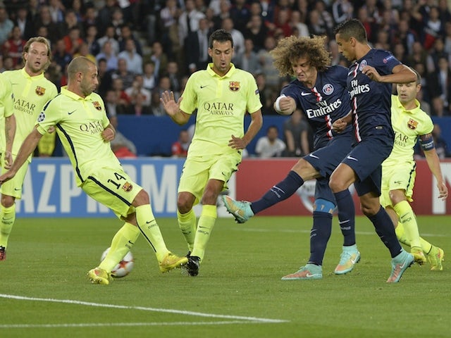 Paris' Brazilian defender David Luiz (3rdR) scores a goal during the UEFA Champions League football match Paris Saint-Germain (PSG) vs Barcelona (FCB) on September 30, 2014