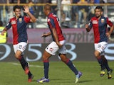Diego Perotti (L) of Genoa CFC celebrates with his team-mate Sebastian De Maio (C) after scoring the opening goal during the Serie A match against Parma on October 5, 2014