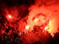 Galatasaray AS light flare after conceding a second goal during the UEFA Champions League group D match between Arsenal FC and Galatasaray AS at Emirates Stadium on October 1, 2014