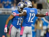 Golden Tate #15 celebrates with Jeremy Ross #12 of the Detroit Lions after a first quarter touchdown agains the Buffalo Bills at Ford Field on October 05, 2014 