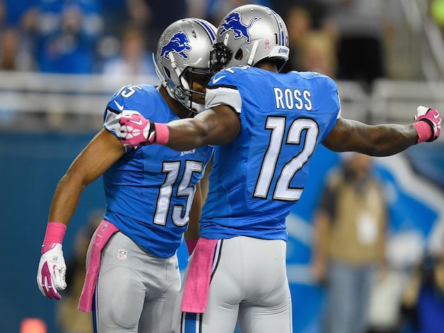 Golden Tate #15 celebrates with Jeremy Ross #12 of the Detroit Lions after a first quarter touchdown agains the Buffalo Bills at Ford Field on October 05, 2014 