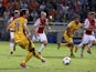 APOEL Nicosia's Gustavo Manduca kicks the ball to score a goal against Ajax Amsterdam during their group F UEFA Champions League football match in the Cypriot capital Nicosia on September 30, 2014