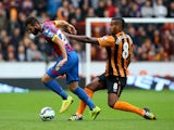 Joe Ledley of Crystal Palace battles for the ball with Tom Huddlestone of Hull City during the Barclays Premier League match between Hull City and Crystal Palace at KC Stadium on October 4, 2014