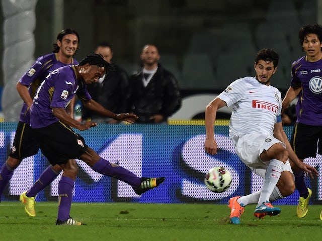 Juan Gillermo Cuadrado of Fiorentina scores his team's second goal during the Serie A match against Inter on October 5, 2014
