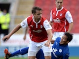 Kari Arnason of Rotherham United challenges Leonardo Ulloa of Leicester City during the Pre Season Friendly match between Rotherham United and Leicester City at The New York Stadium on August 5, 2014