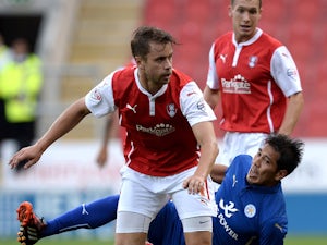 Kari Arnason of Rotherham United challenges Leonardo Ulloa of Leicester City during the Pre Season Friendly match between Rotherham United and Leicester City at The New York Stadium on August 5, 2014