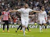 Real Madrid's French forward Karim Benzema celebrates after scoring during the Spanish league football match Real Madrid vs Athletic Club Bilbao at the Santiago Bernabeu stadium in Madrid on October 5, 2014