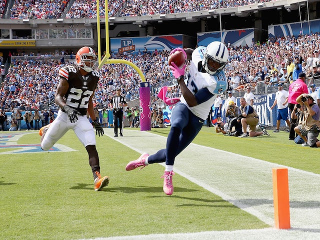 Kendall Wright #13 of the Tennessee Titans catches a pass for a touchdown during the game against the Cleveland Browns at LP Field on October 5, 2014 