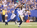 LaRon Landry #30 of the Indianapolis Colts breaks up a pass intended for Marques Colston #12 of the New Orleans Saints during the exhibition game at Lucas Oil Stadium on August 23, 2014