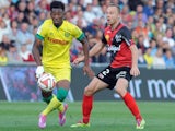 Guingamp's Danish defender Lars Jacobsen (R) vies with Nantes' French midfielder Georges Kevin Nkoudou during the French L1 football match Guingamp vs Nantes on October 5, 2014