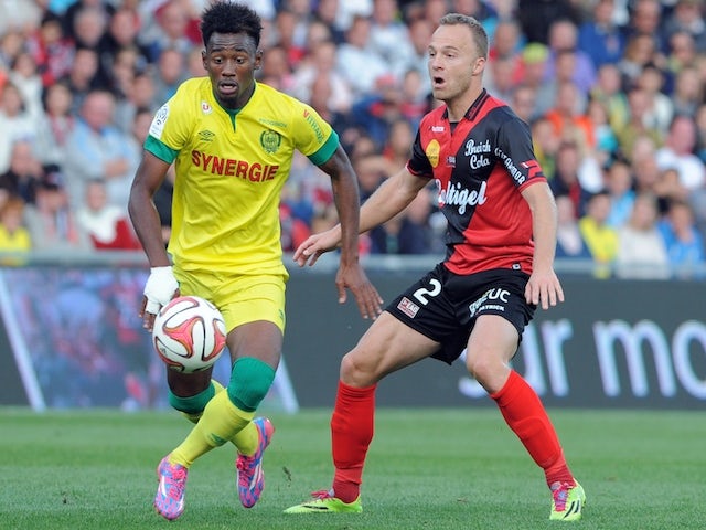 Guingamp's Danish defender Lars Jacobsen (R) vies with Nantes' French midfielder Georges Kevin Nkoudou during the French L1 football match Guingamp vs Nantes on October 5, 2014