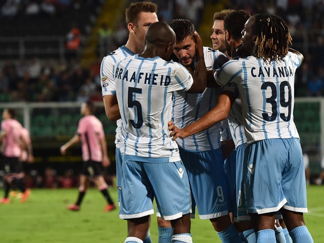 Filip Djordjevic of Lazio celebrates with team mates after scoring the opening goal during the Serie A match between US Citta di Palermo and SS Lazio at Stadio Renzo Barbera on September 29, 2014