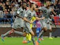 Marseille's French forward Andre-Pierre Gignac celebrates with teammates after scoring a goal during the French L1 football match between Caen and Marseille at the Michel d'Ornano stadium in Caen, western France, on October 4, 2014