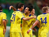 Nemanja Matic of Chelsea (21) celebrates with team mate Cesc Fabregas as he scores their first goal during the UEFA Champions League Group G match against Sporting Lisbon on September 30, 2014