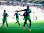 Newcastle player Papiss Cisse celebrates after scoring the first Newcastle goal during the Barclays Premier League match between Swansea City and Newcastle United at Liberty Stadium on October 4, 2014