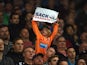A young Newcastle fan holds up a sign calling for Alan Pardew, manager of Newcastle United, to be sacked during the Barclays Premier League match between Stoke City and Newcastle United at Britannia Stadium on September 29, 2014