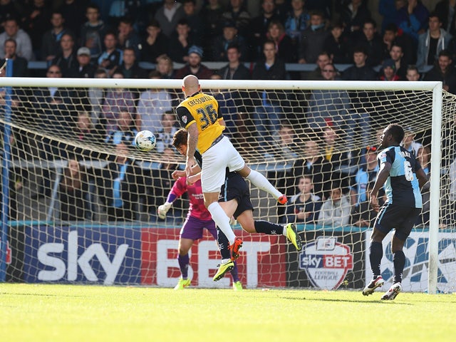Ryan Cresswell of Northampton Town rises to head his sides 1st goal during the Sky Bet League Two match between Wycombe Wanderers and Northampton Town at Adams Park on October 4, 2014