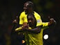 Odion Ighalo of Watford (front) celebrates with Lloyd Dyer as he scores their first goal during the Sky Bet Championship match against Brentford on September 30, 2014