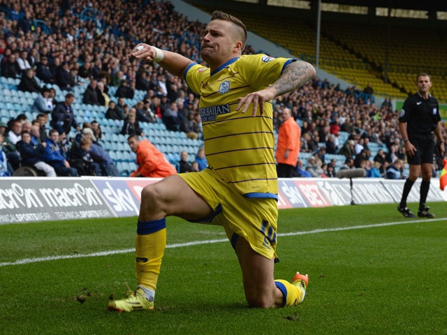 Chris Maguire of Sheffield Wednesday celebrates after scoring their first goal during the Sky Bet Championship match between Leeds United and Sheffield Wednesday at Elland Road on October 4, 2014