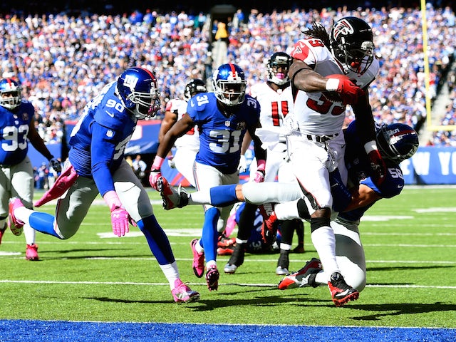 Running back Steven Jackson #39 of the Atlanta Falcons scores a ten yard touchdown in the first quarter against the New York Giants on October 5, 2014