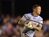 Todd Carney of the Sharks passes the ball during the round 15 NRL match between the Cronulla-Sutherland Sharks and the Manly-Warringah Sea Eagles at Remondis Stadium on June 21, 2014