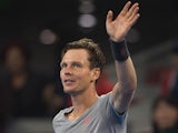 Tomas Berdych of the Czech Republic waves to the crowd after beating Martin Klizan of Slovakia during their men's singles semi-final match at the China Open tennis tournament in the National Tennis Center of Beijing on October 4, 2014