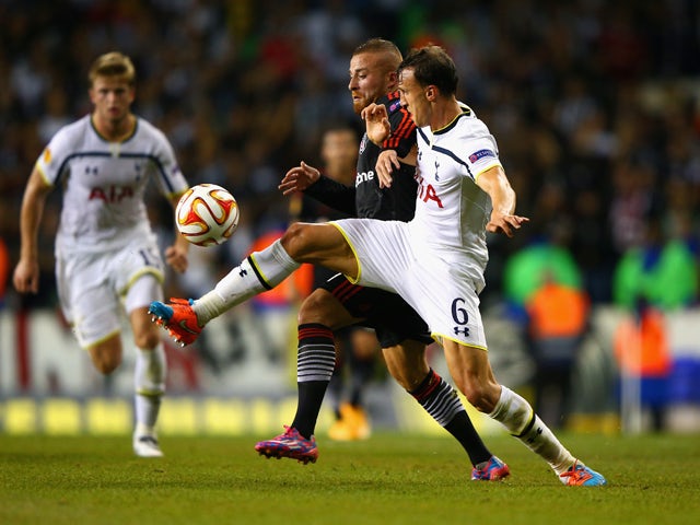 Gokhan Tore of Besiktas and Vlad Chiriches of Spurs battle for the ball during the UEFA Europa League Group C match between Tottenham Hotspur FC and Besiktas JK at White Hart Lane on October 2, 2014