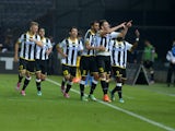 Thomas Heurtaux of Udnese Calcio celebrates with team mates after scoring his teams third goal during the Serie A between Udinese Calcio and Parma FC at Stadio Friuli on September 29, 2014
