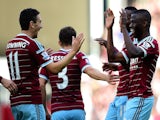 West Ham players, including Enner Valencia and Stewart Downing, celebrate after Nedum Onuoha of QPR scored an own goal during the Barclays Premier League match on October 5, 2014