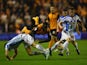 Nouha Dicko of Wolverhampton Wanderers is challenged by Jack Robinson and Jonathan Hogg of Huddersfield Town during the Sky Bet Championship match between Wolverhampton Wanderers and Huddersfield Town at Molineux on October 1, 2014