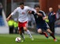Andrew Robertson of Scotland battles for the ball with Giorgi Papava of Georgia during the EURO 2016 Qualifier match on October 11, 2014