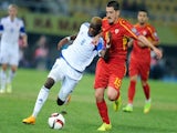 Macedonia's midfielder Arijan Ademi (R) vies with Luxembourg 's defender Christopher Martins Pereira (L) during the Euro 2016 group D qualifying football match on October 9, 2014