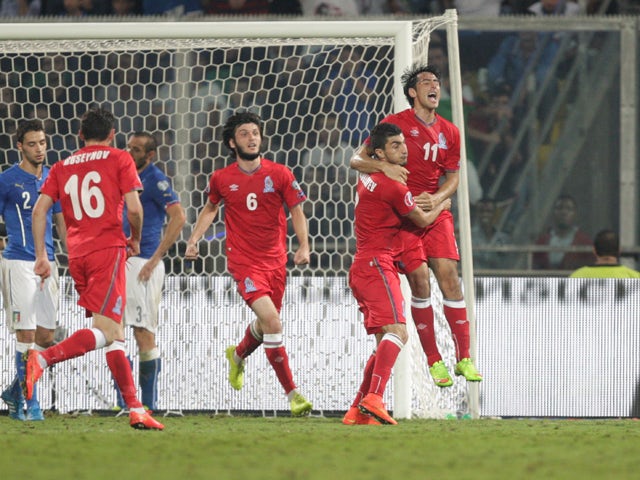Azerbaijan's Rauf Aliyev celebrates after scoring during the UEFA Euro 2016 group H qualifying football match between Italy and Azerbaijan on October 10, 2014