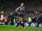 Ben Flower of Wigan walks from the pitch after receiving a red card during the First Utility Super League Grand Final match between St Helens and Wigan Warriors at Old Trafford on October 11, 2014