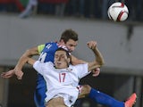 Croatia's Defender Darijo Srna fights for the ball with Bulgaria's Midfielder Georgi Milanov during the Euro 2016 group H qualifying football match between Bulgaria and Croatia at the Vassil Levski stadium in Sofia, Bulgaria on October 10, 2014