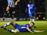 Callum Davies of Gillingham tackles Gabriel Obertan of Newcastle United during the Capital One Cup second round match between Gillingham and Newcastle United at Priestfield Stadium on August 26, 2014