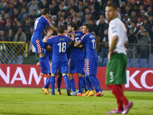 Croatia's players celebrate the own goal of Bulgaria during the Euro 2016 group H qualifying football match between Bulgaria and Croatia at the Vassil Levski stadium in Sofia, Bulgaria on October 10, 2014