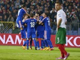 Croatia's players celebrate the own goal of Bulgaria during the Euro 2016 group H qualifying football match between Bulgaria and Croatia at the Vassil Levski stadium in Sofia, Bulgaria on October 10, 2014