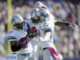Glover Quin #27, Devin Taylor #92 and Darius Slay #23 of the Detroit Lions celebrate a interception by Quin during the first quarter of the game on October 12, 2014