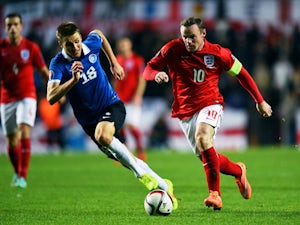 Rooney hails "young" England's resolve