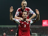 Albania's Ermir Lenjani and Ansi Agolli celebrate after scoring during the Euro 2016 qualifying round football match between Albania and Denmark at the Elbasan Arena Stadium, on October 11, 2014