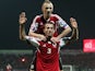Albania's Ermir Lenjani and Ansi Agolli celebrate after scoring during the Euro 2016 qualifying round football match between Albania and Denmark at the Elbasan Arena Stadium, on October 11, 2014