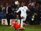 Fabian Delph of England is tackled by Stephan Lichtsteiner of Switzerland during the UEFA EURO 2016 Group E qualifying match between Switzerland and England at St Jakob-Park on September 8, 2014