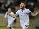 Iceland's Aron Gunnarsson celebrate after scoring during their Euro 2016 qualifier football match Latvia vs Iceland in Riga on October 10, 2014